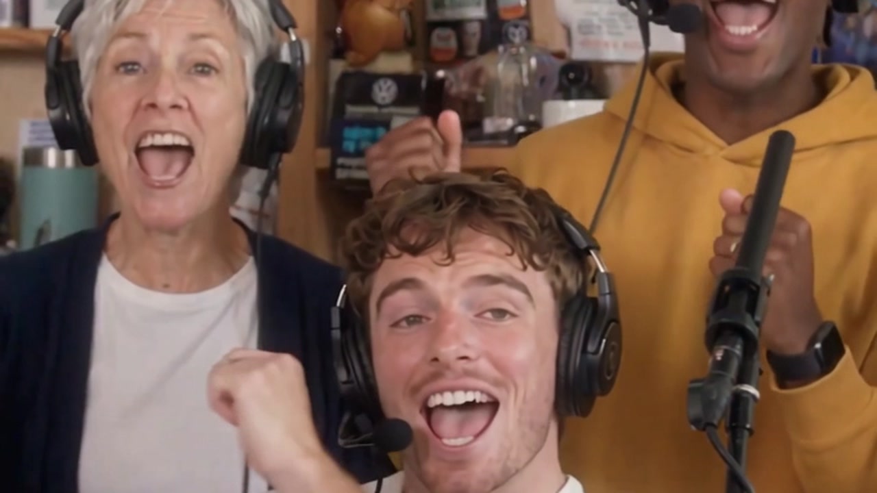 A character singing at a tiny desk microphone in the meme style